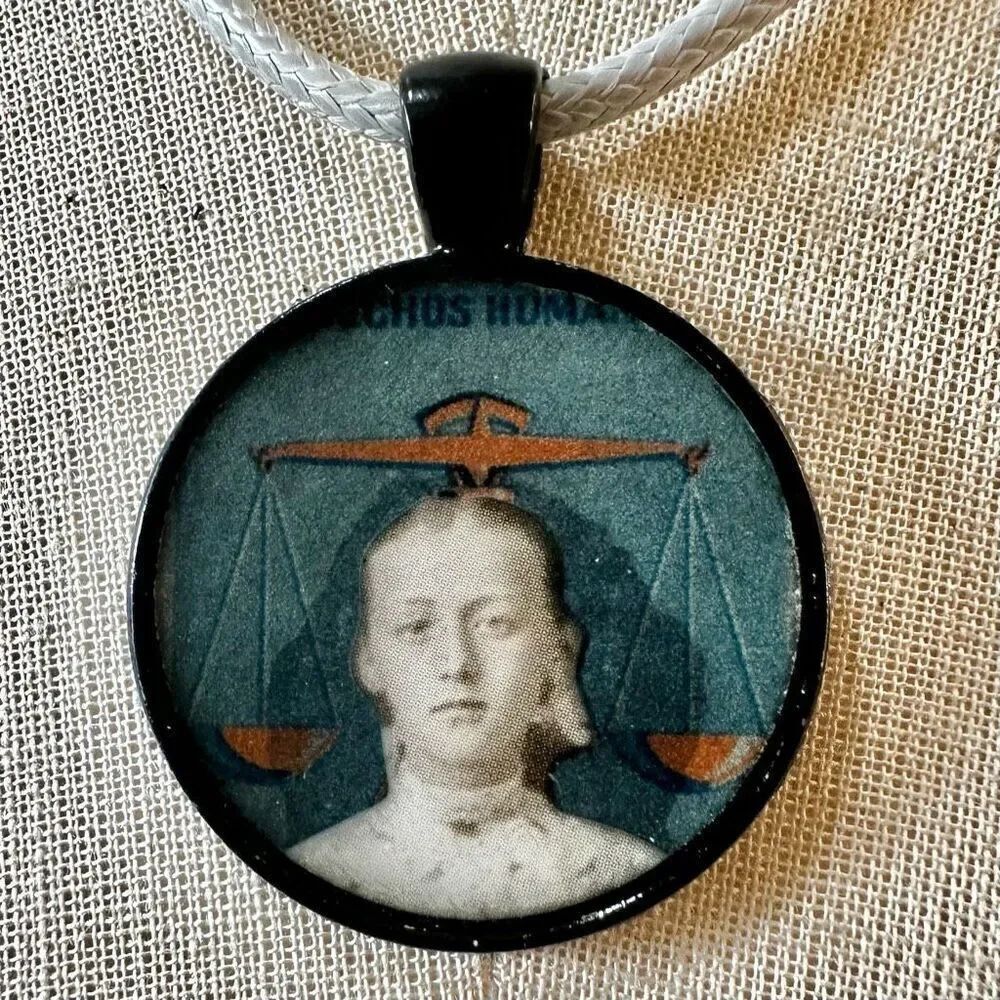 Girl with scales pendant necklace on cord